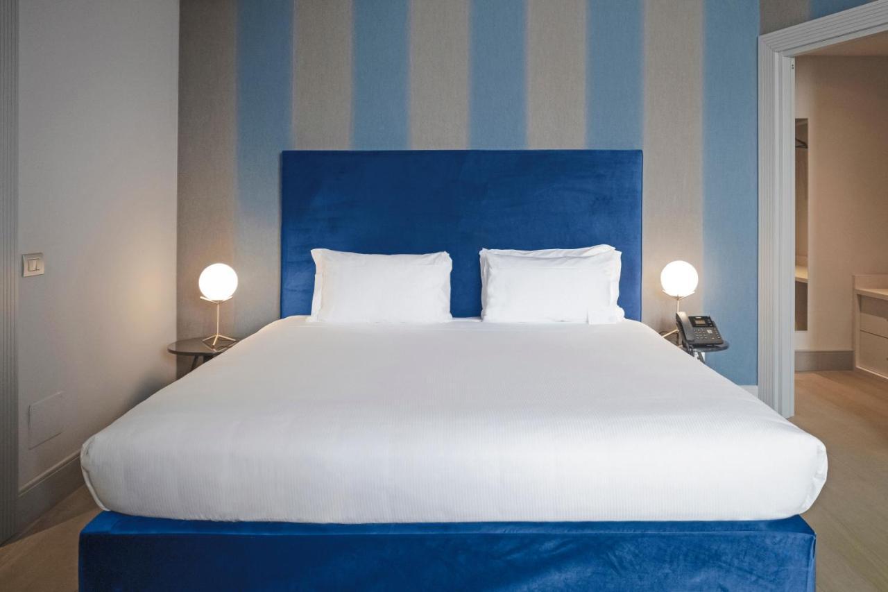 ホテル パラッツォ コーナリア ミラノ エクステリア 写真 A bedroom at the hotel
